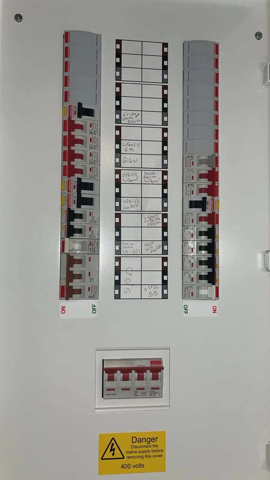 Commercial electrical distribution board with circuit positions and switching devices.
