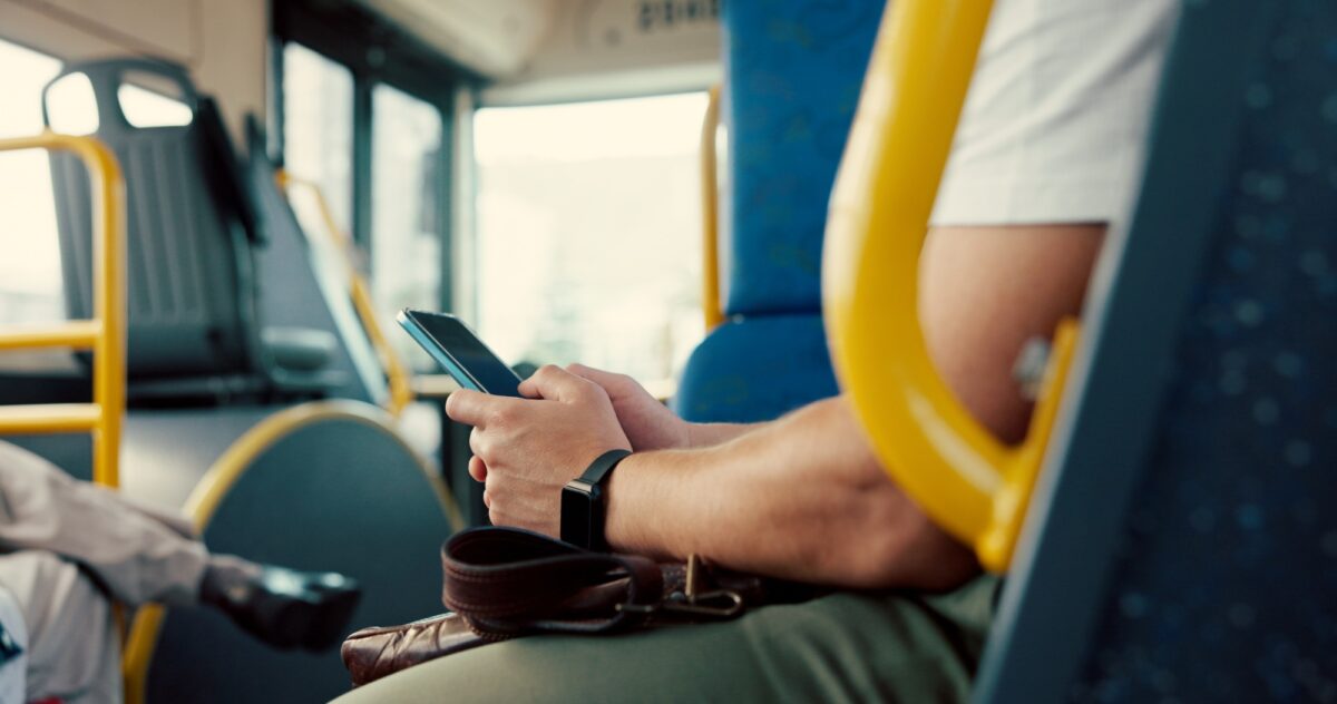Typing, hands and person with phone on bus for travel schedule, online scroll and morning commute.