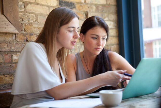 Businesswomen having meeting in coffee bar, London